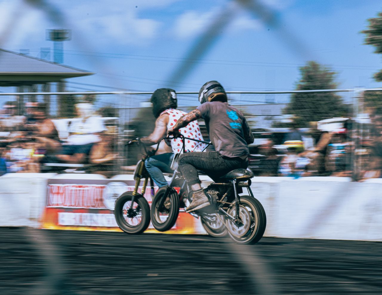 Dynamic motorbike race scene with focused blur, exuding speed and thrill.